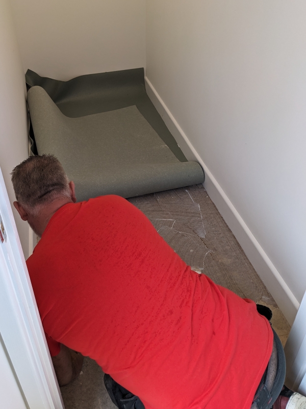 Interior showing flooring being laid in the storage area.